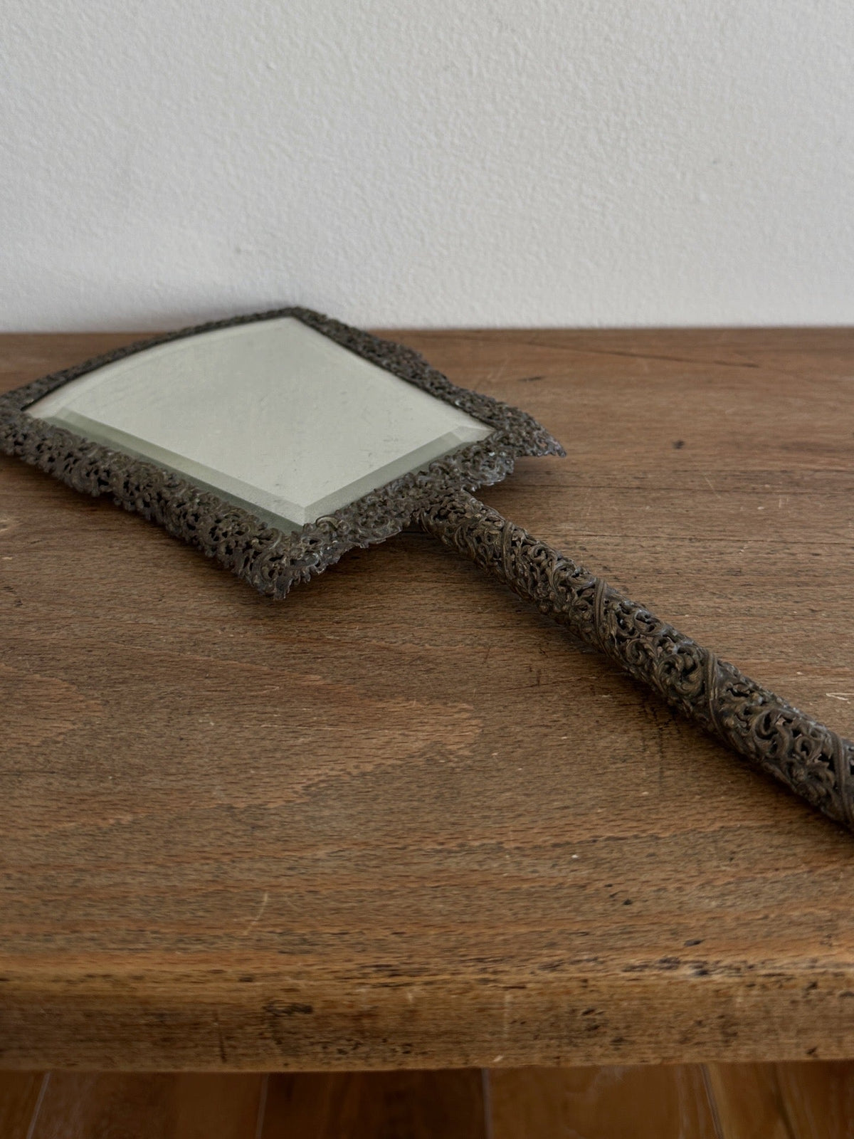 Antique hand mirror in a metal frame - House on Horizon