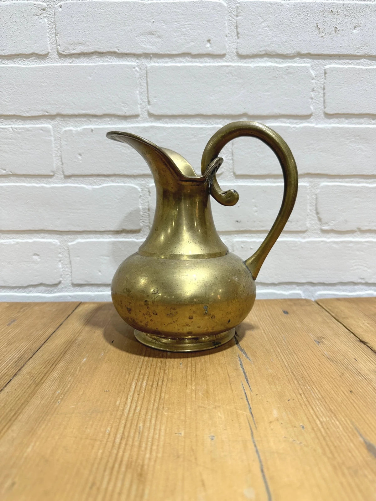 Brass pitcher - House on Horizon