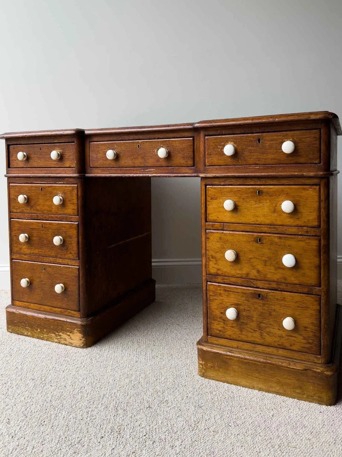Dark waxed English antique pine desk with white knobs - House on Horizon
