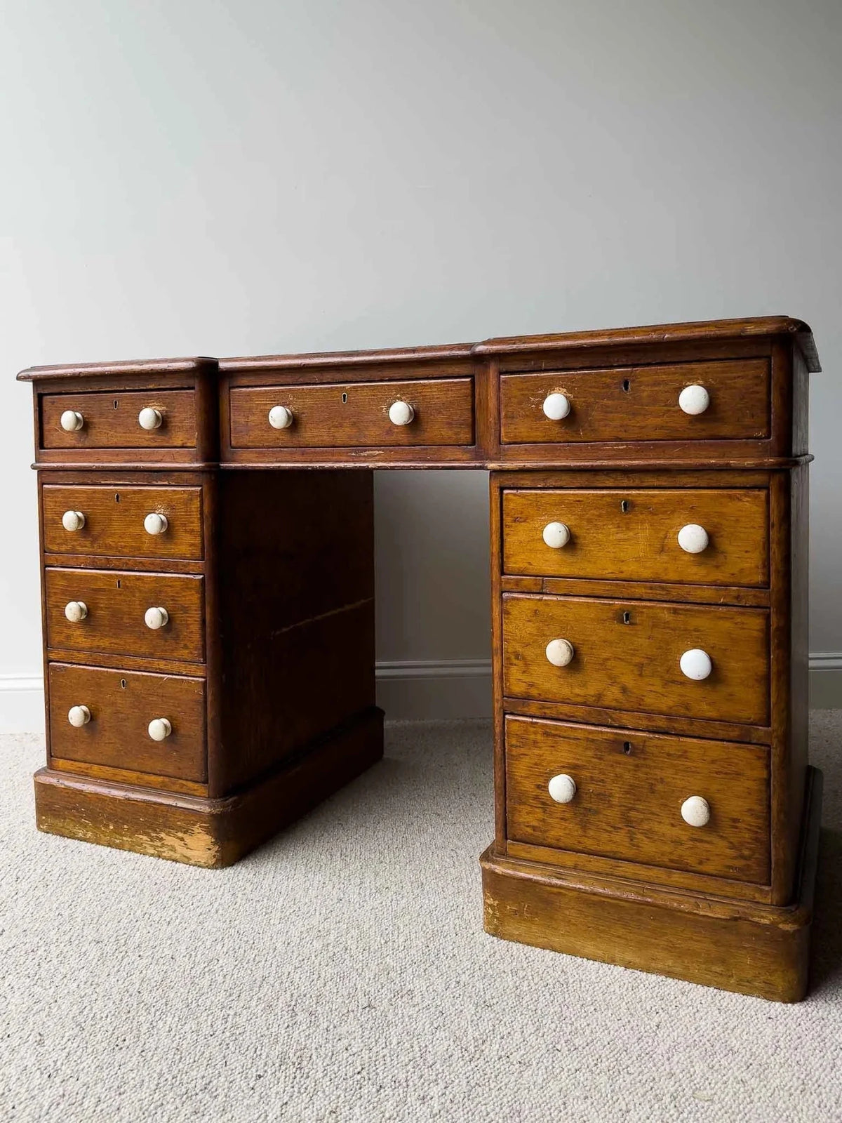 Dark waxed English antique pine desk with white knobs - House on Horizon