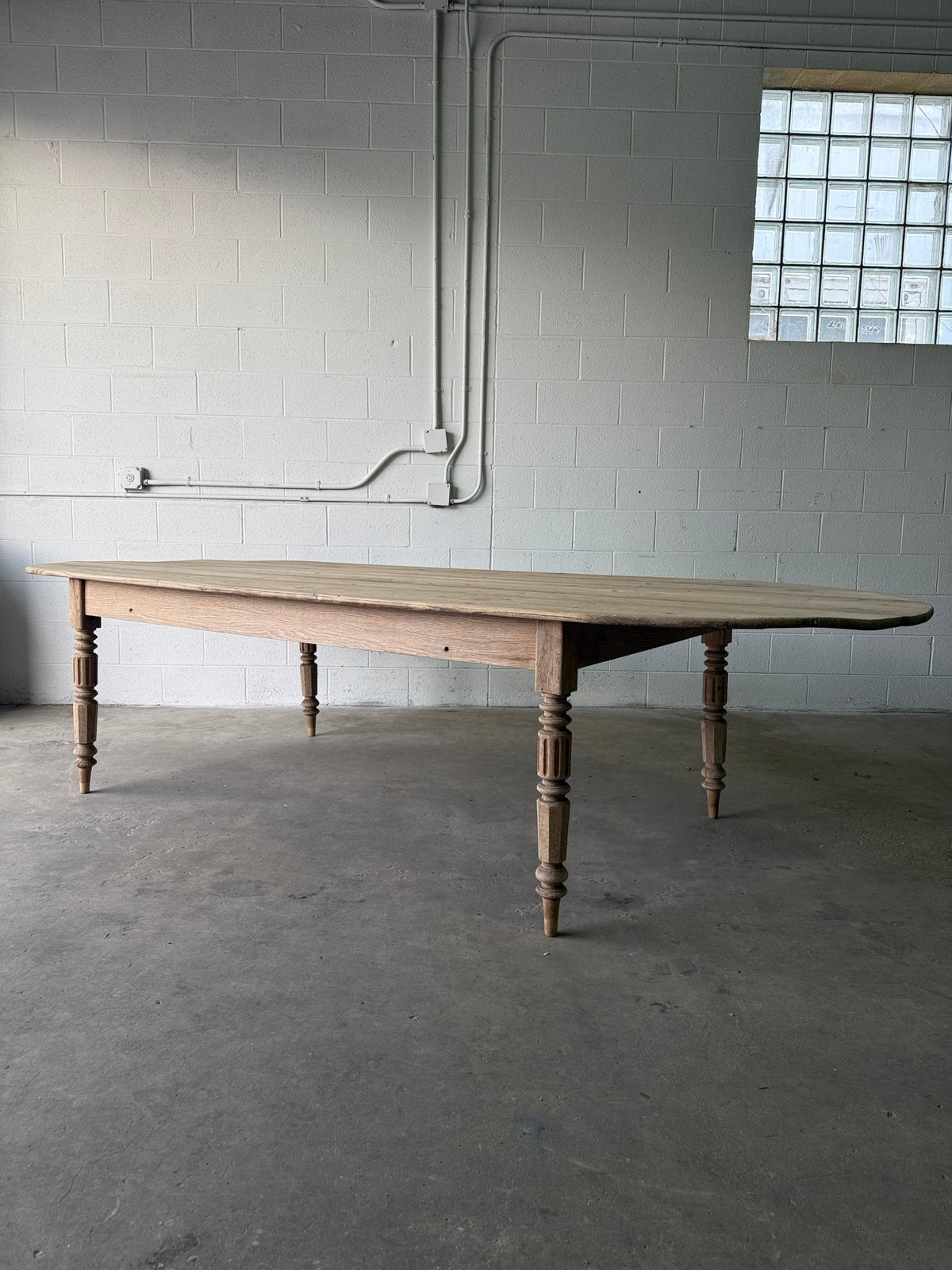 Gorgeous French pill-shaped dining table - House on Horizon