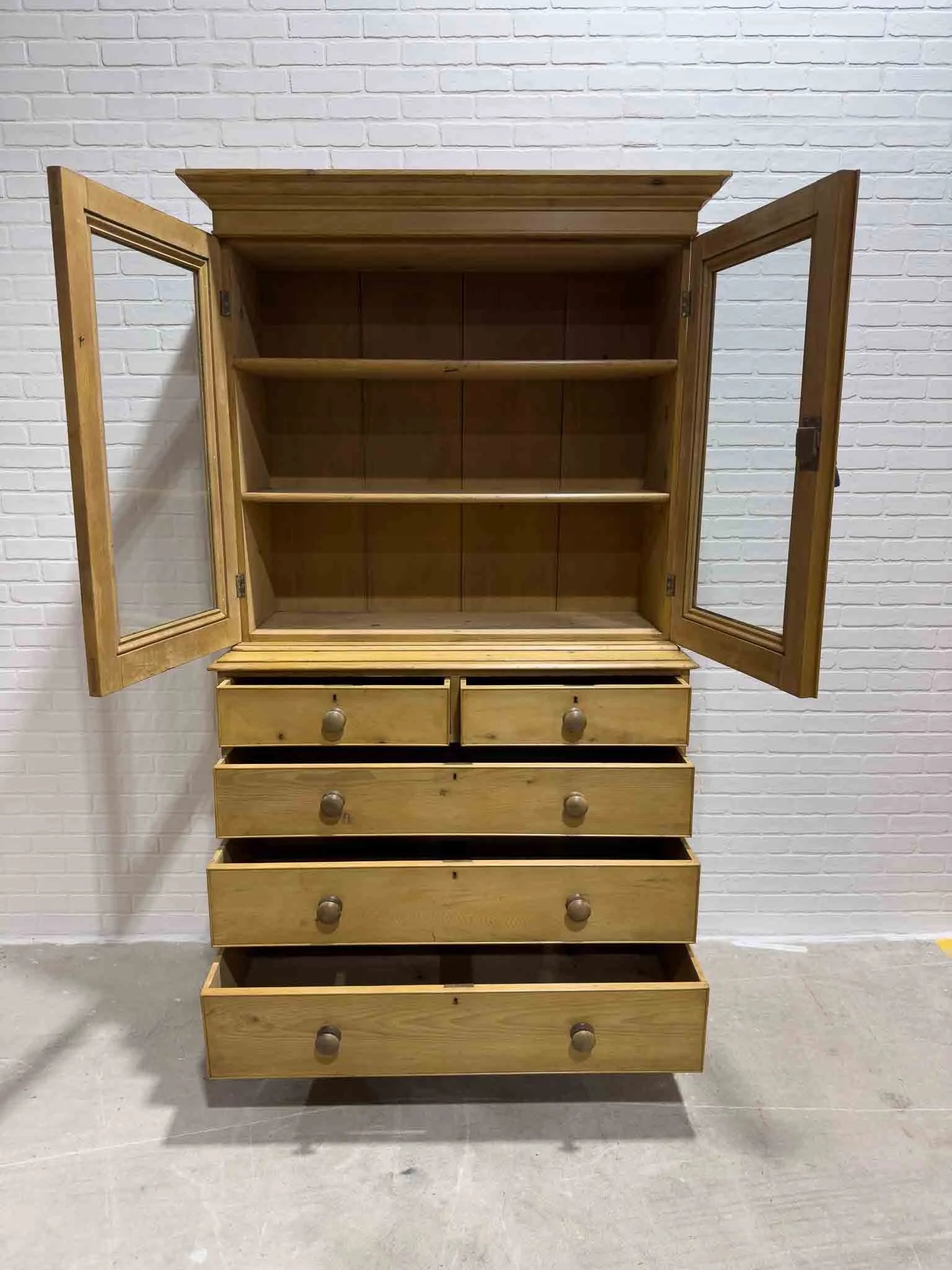 Antique English cupboard with glass doors