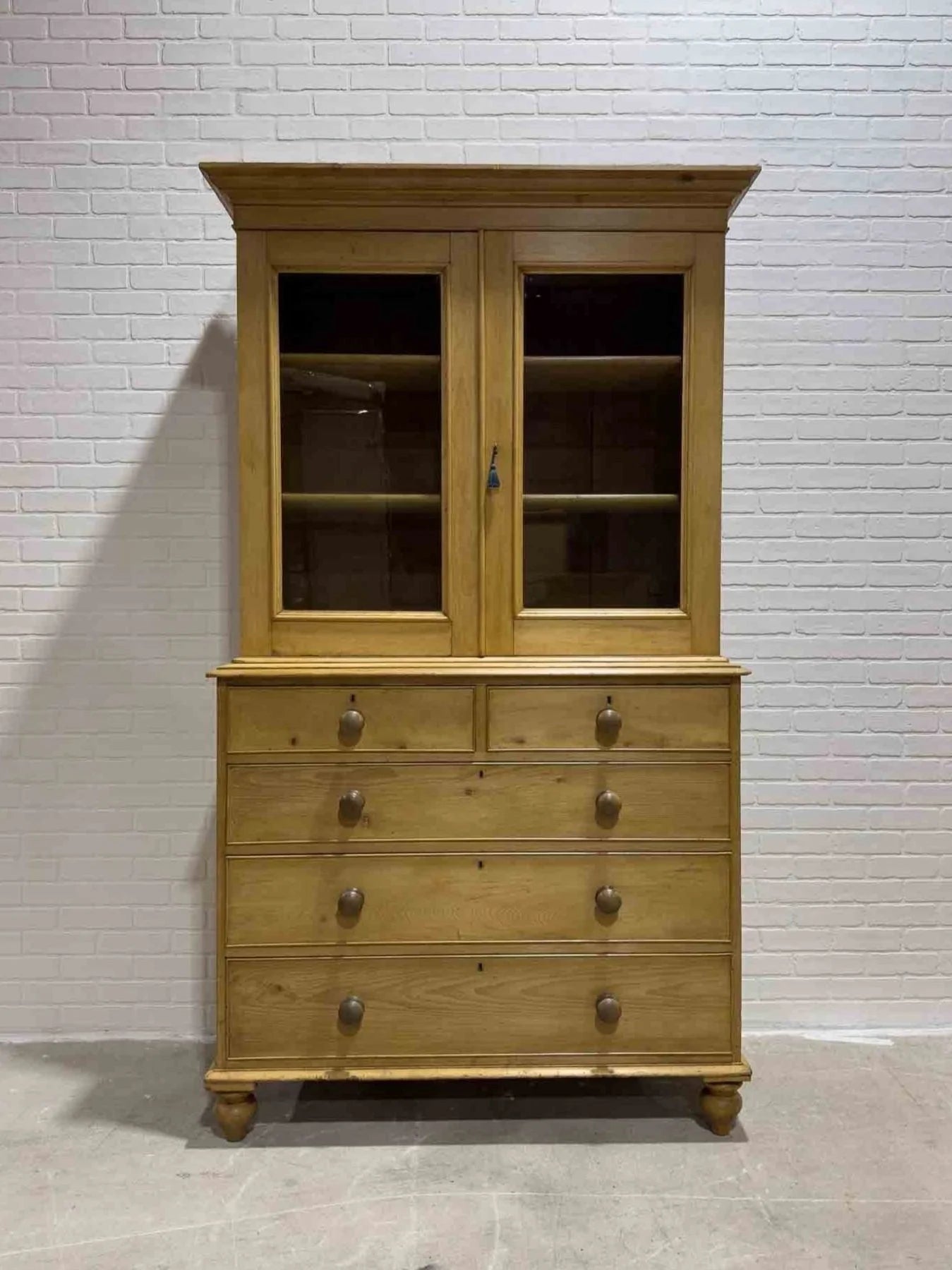 Antique English cupboard with glass doors