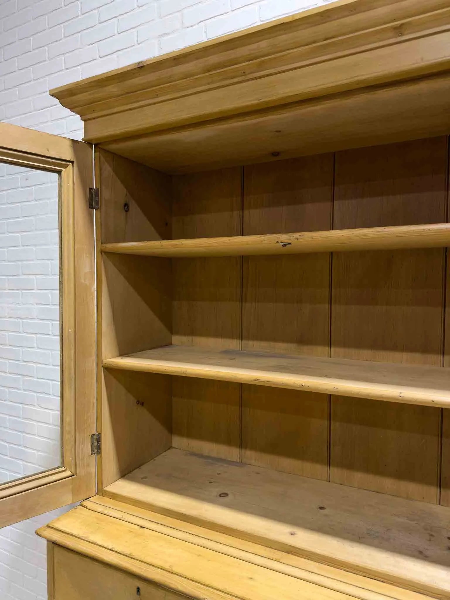 Antique English cupboard with glass doors