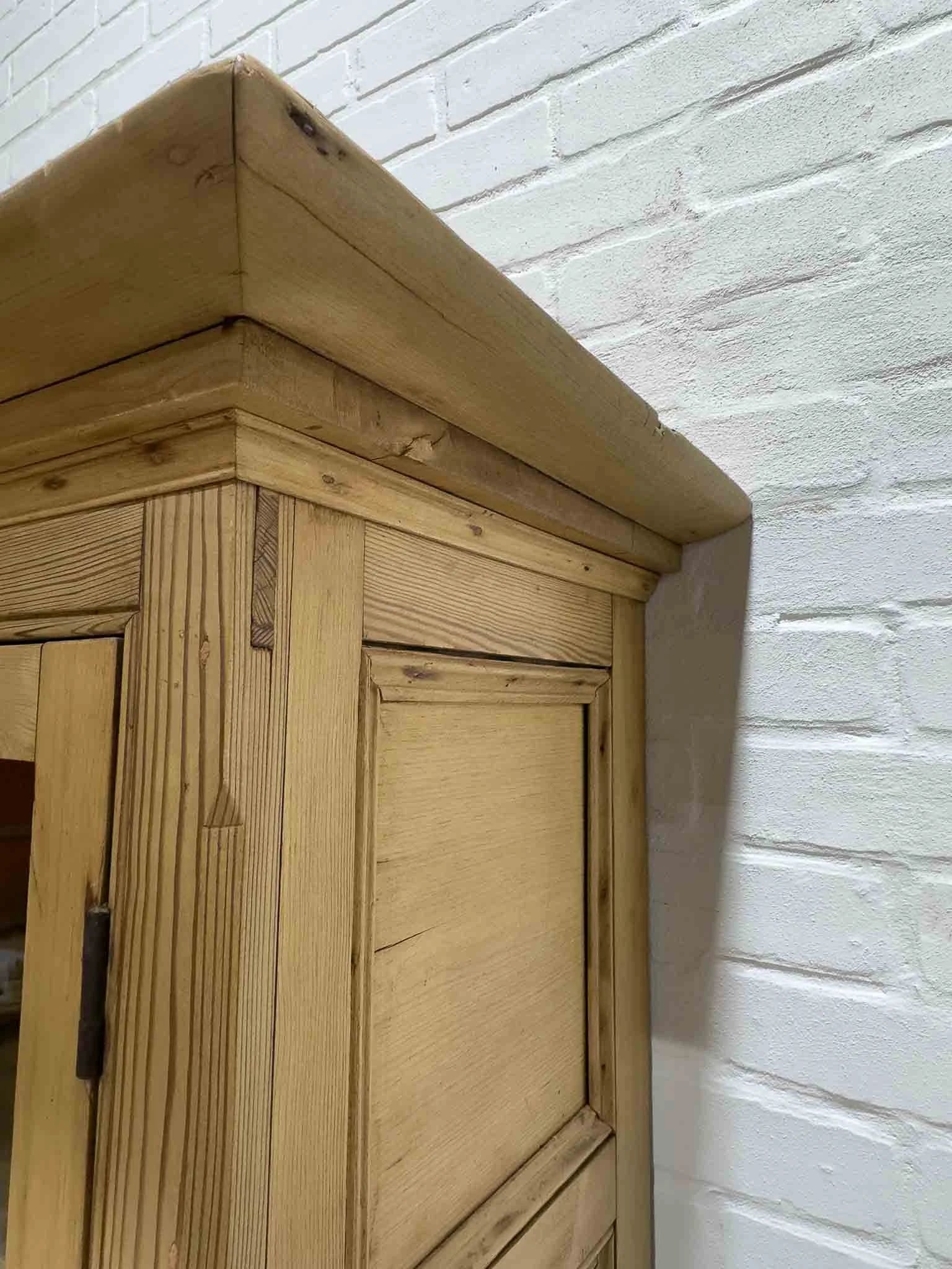 Antique English cupboard with glass doors