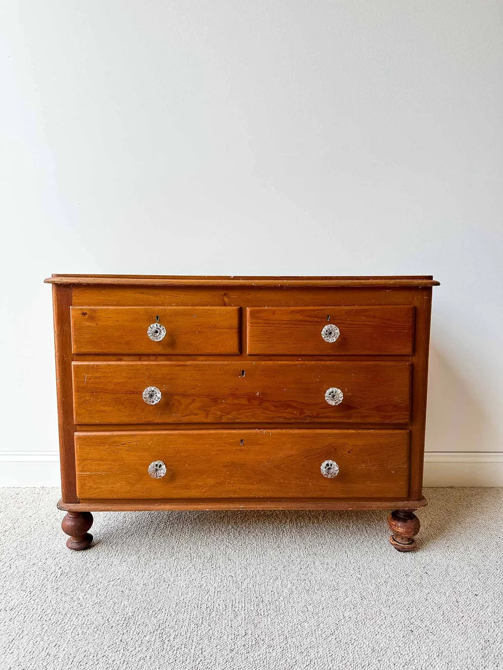 Small English pine set of drawers with glass knobs