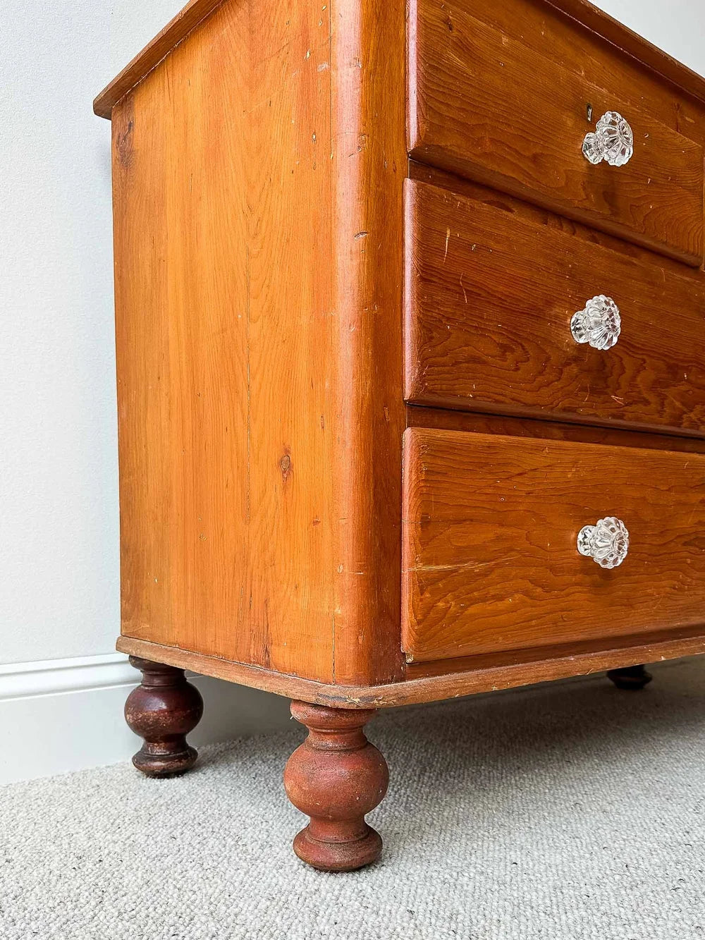 Small English pine set of drawers with glass knobs