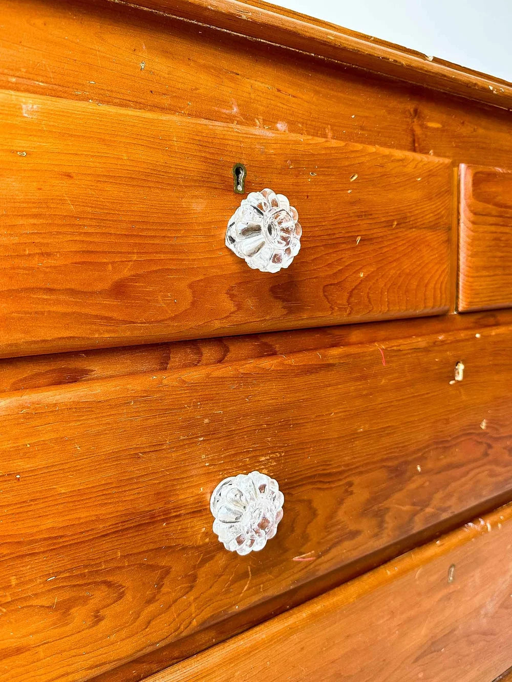 Small English pine set of drawers with glass knobs