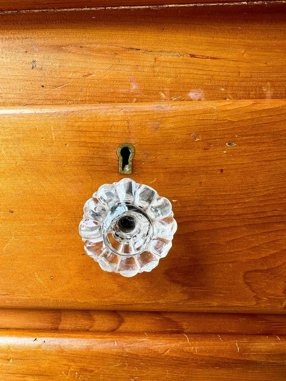 Small English pine set of drawers with glass knobs