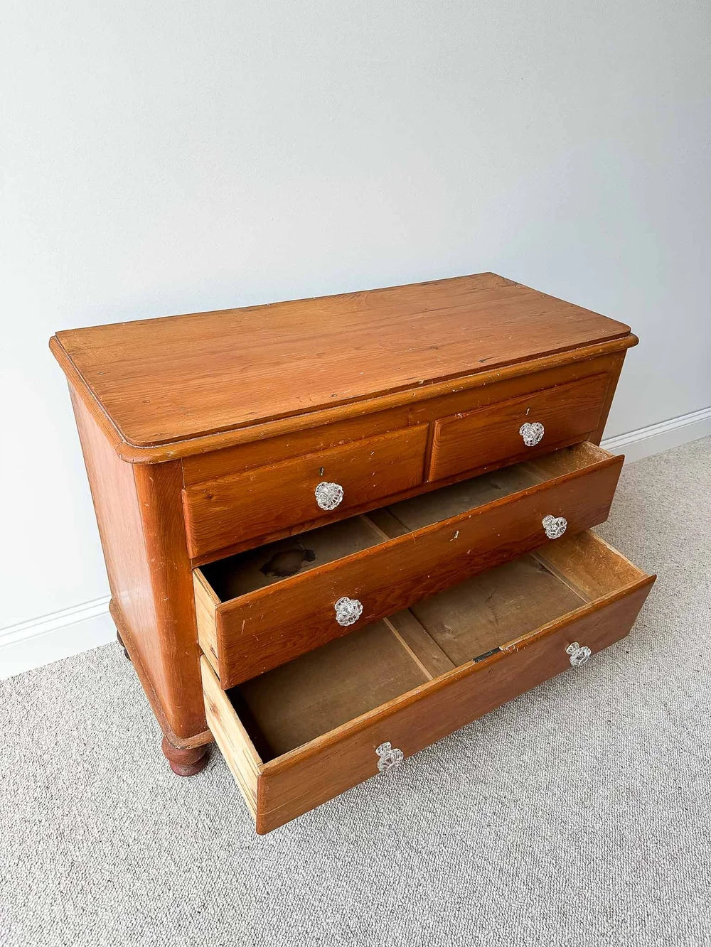 Small English pine set of drawers with glass knobs