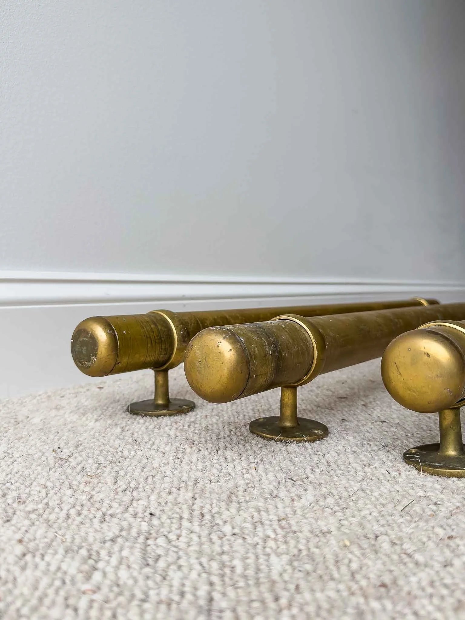 Three vintage brass foot rails