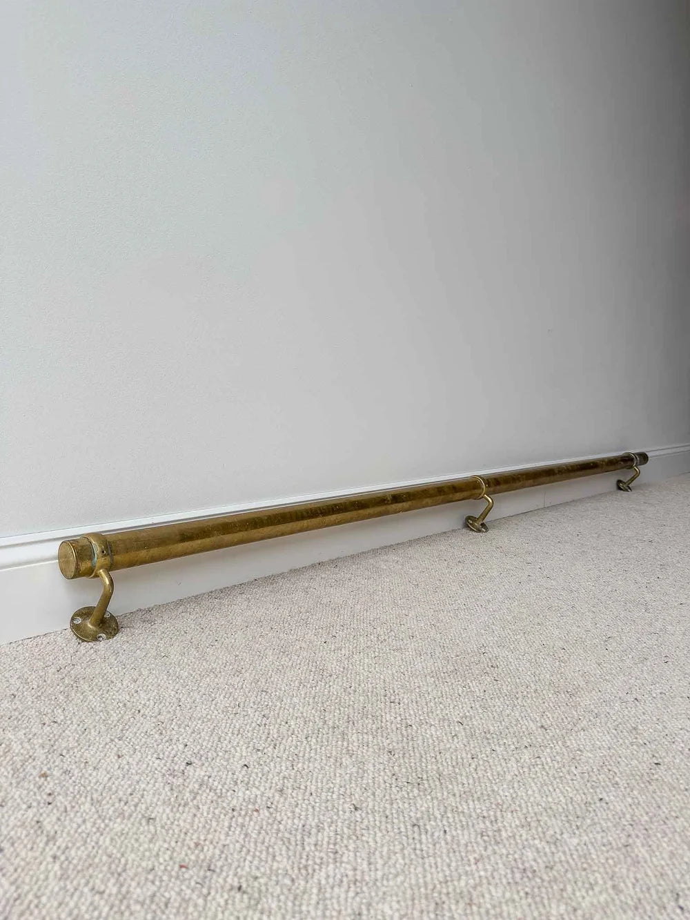 Long antique brass foot rail