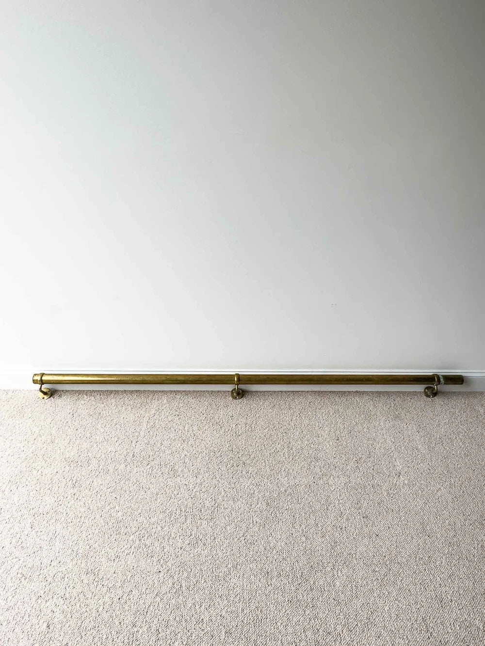 Long antique brass foot rail