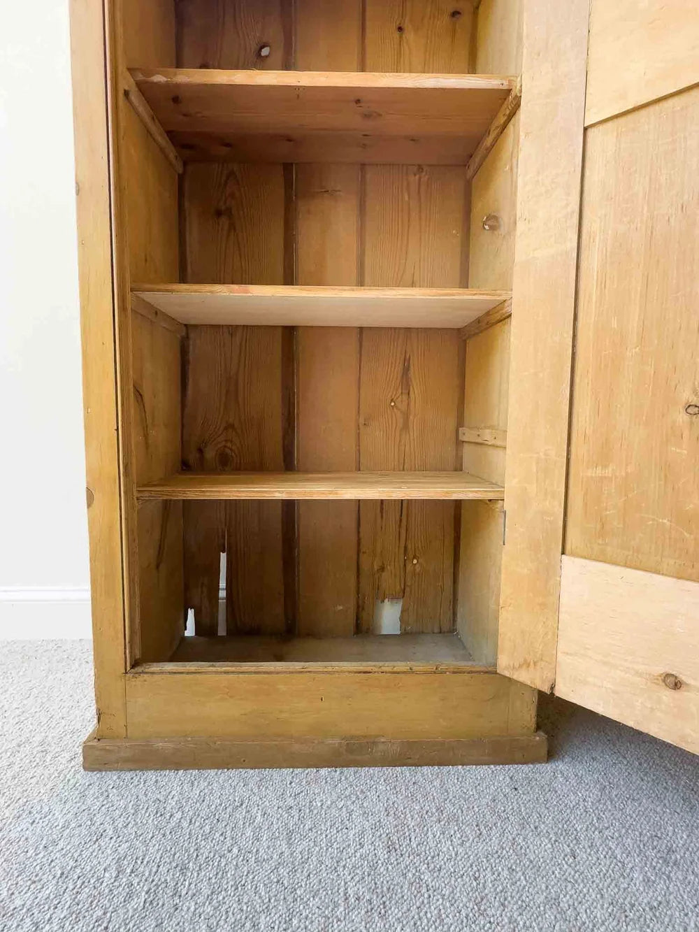 Tall English antique pine cupboard