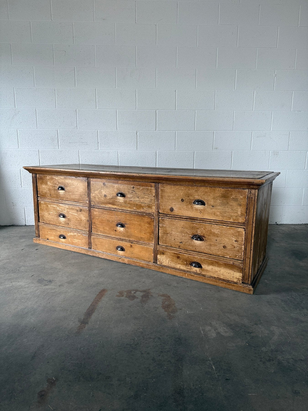 Low bank of 9 antique European drawers - House on Horizon