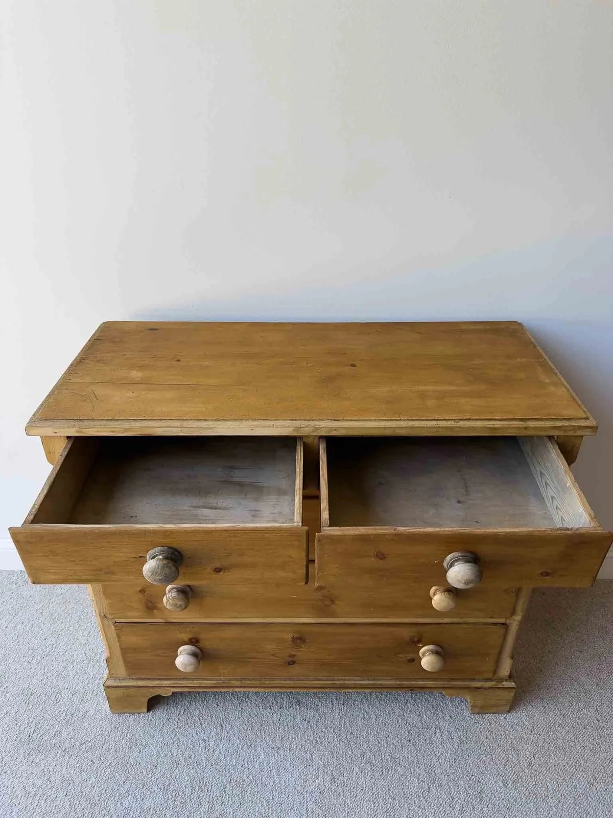 Mid-brown colored set of victorian pine drawers - House on Horizon