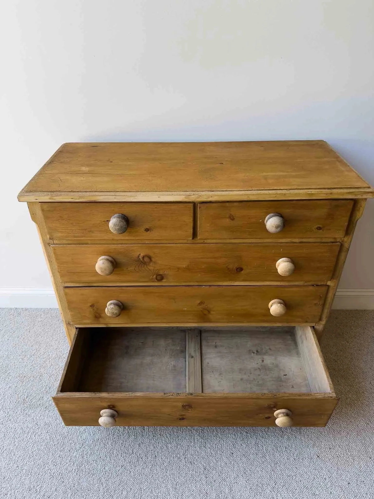Mid-brown colored set of victorian pine drawers - House on Horizon