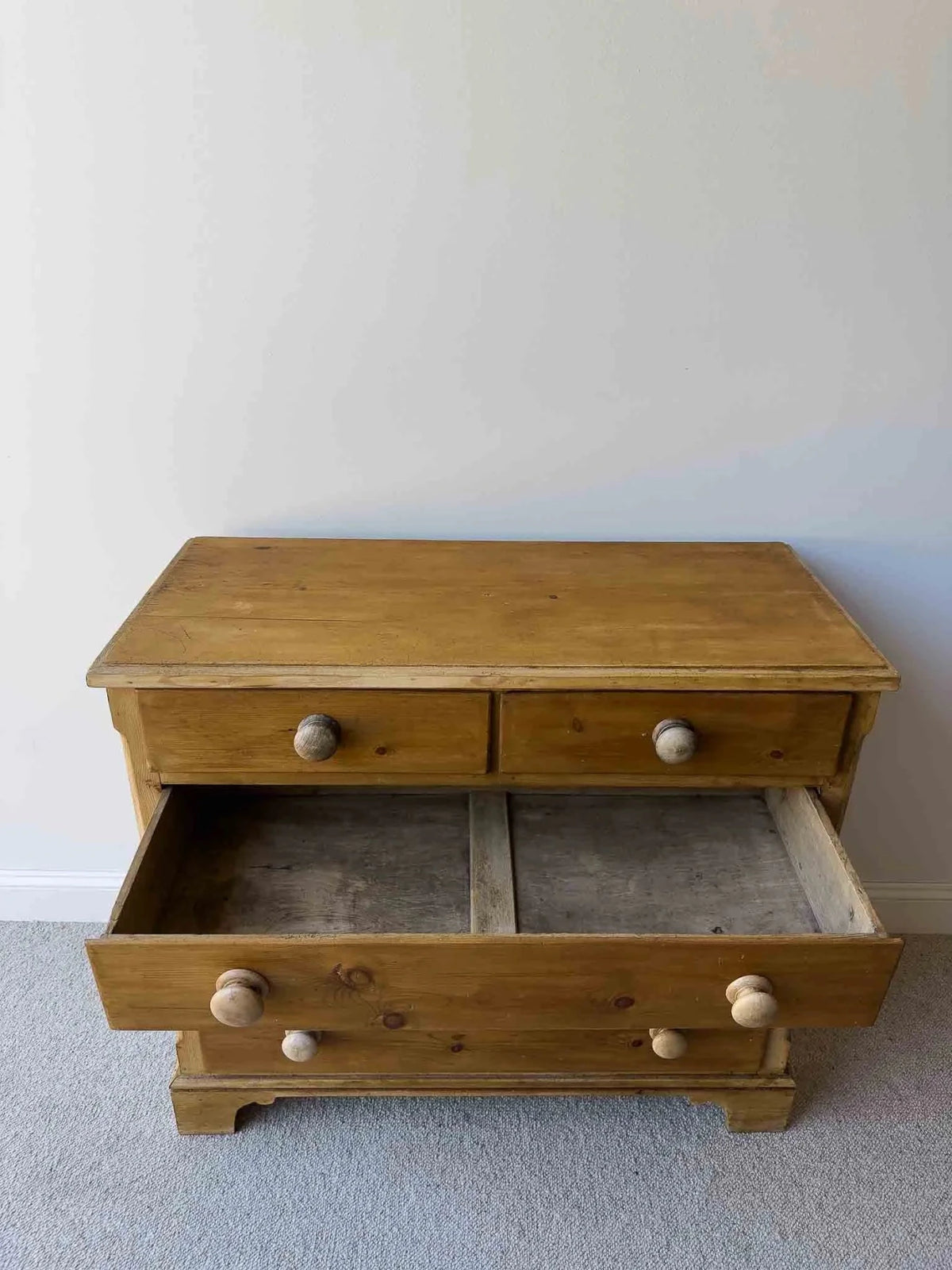 Mid-brown colored set of victorian pine drawers - House on Horizon