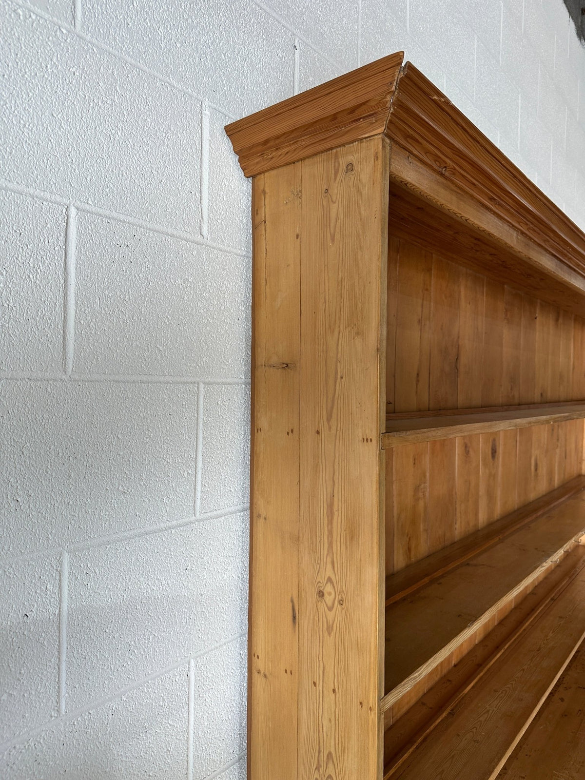 Monumental English pine kitchen dresser with brass pulls and a rounded base - House on Horizon